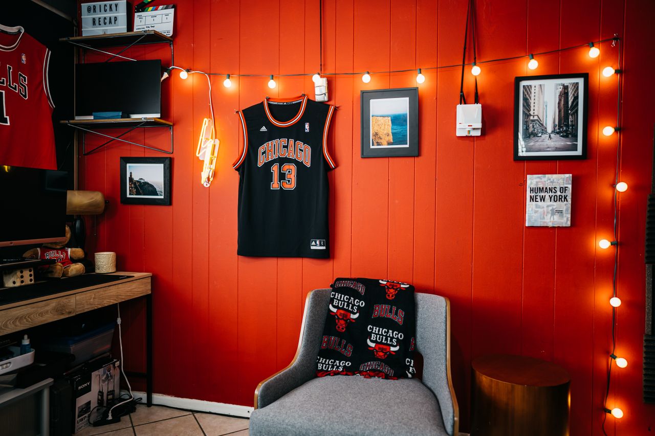Home Cozy indoor space with Chicago Bulls memorabilia and vibrant red walls.